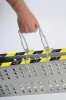 <p>Poignée porte-rampe : s'applique à la partie centrale de la rampe pliée et, une fois verrouillée, permet de la transporter confortablement</p>
